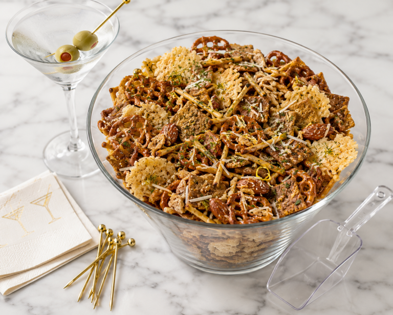 Dirty Martini Parmesan savory snack mix with pretzel snaps, rye chips, almonds, Parmesan crisps, and a martini glass.